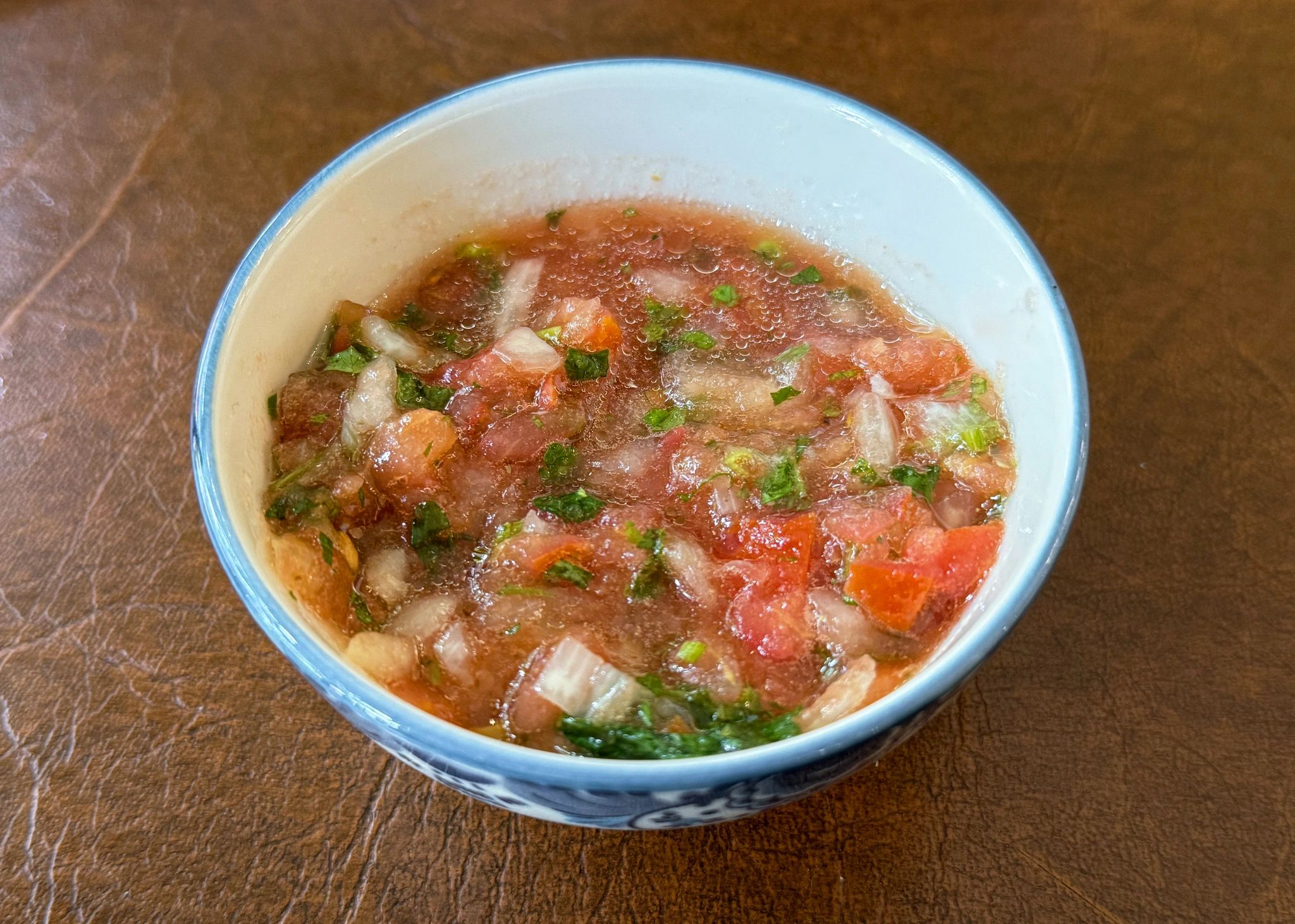 Bowl of fresh tomato salsa with herbs